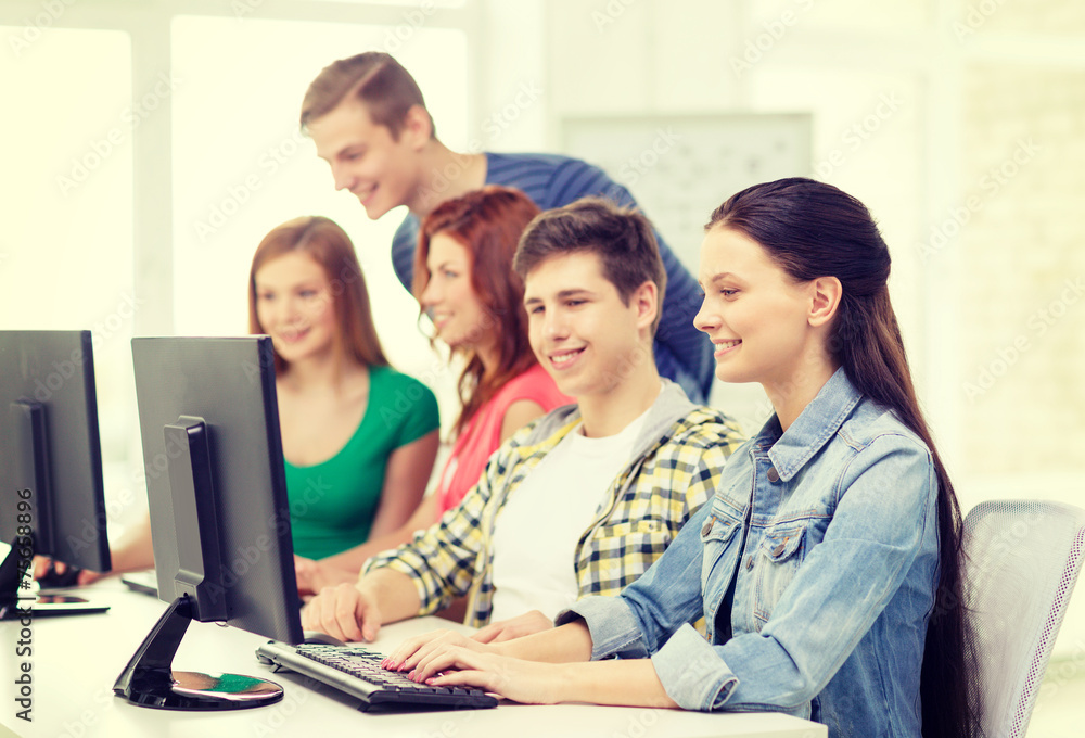 female student with classmates in computer class female student with classmates in computer class