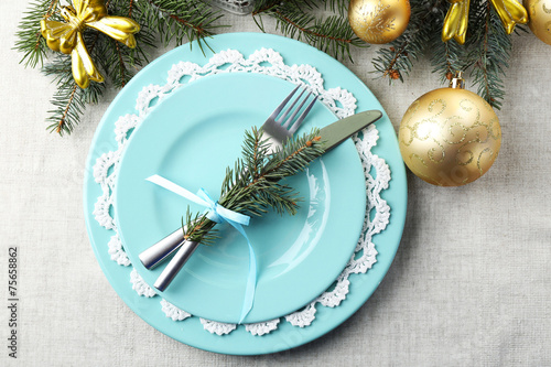 Christmas table setting in blue, golden and whitec olors