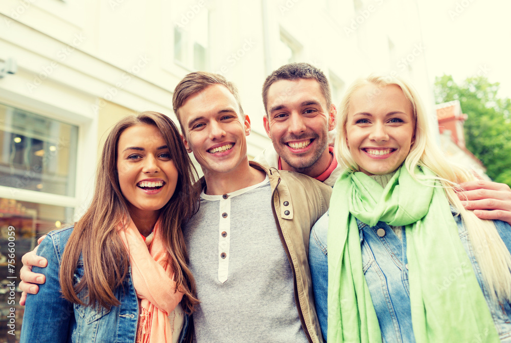 group of smiling friends in city group of smiling friends in city