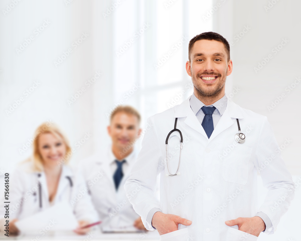 smiling male doctor with stethoscope smiling male doctor with stethoscope