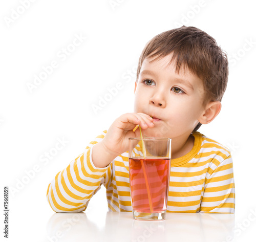 Little boy with glass of apple juice