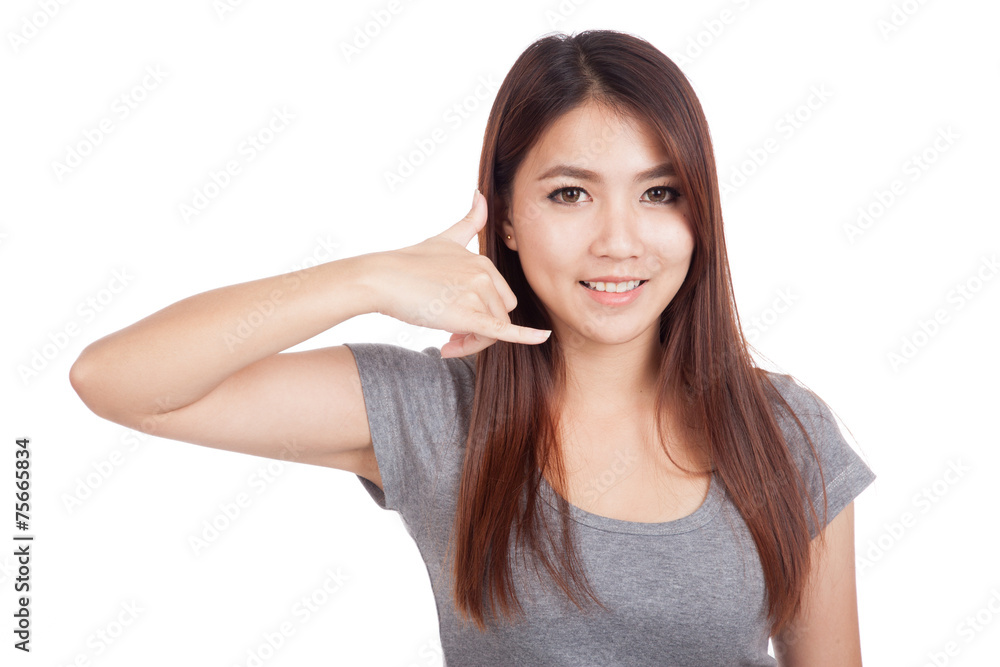 Young Asian businesswoman gesturing phone call Young Asian businesswoman gesturing phone call