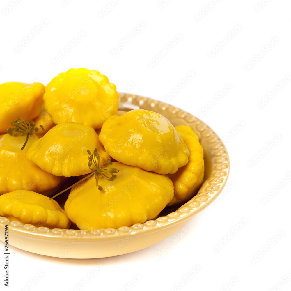 Pickled Pattypan Squash on white background. Selective focus. Pickled Pattypan Squash on white background. Selective focus.