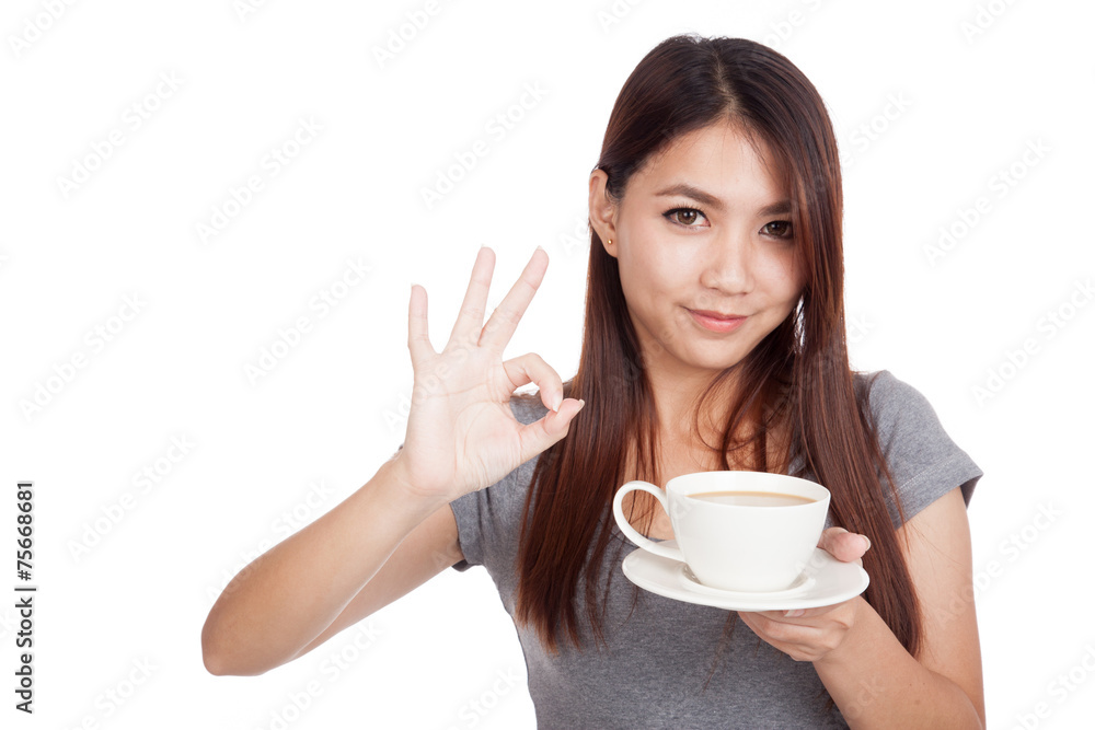 Young Asian woman with cup of coffee Young Asian woman with cup of coffee