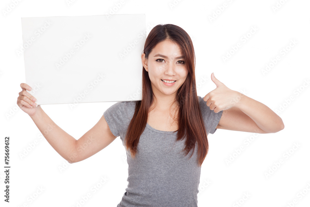 Young Asian woman thumbs up with blank sign