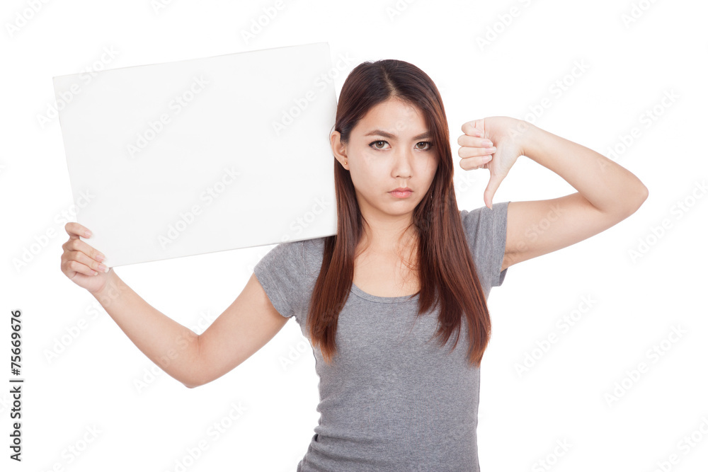 Young Asian woman thumbs down with blank sign Young Asian woman thumbs down with blank sign