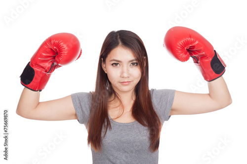 Young Asian woman with red boxing glove