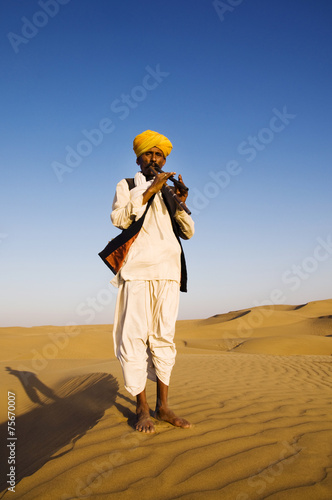 Indigenous Indian Playing Wind Pipe Desert Concept