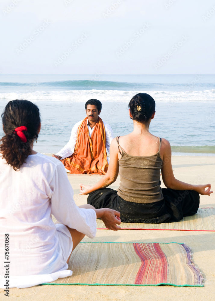 Fototapeta premium Yoga Instructor Students Beach Togetherness Concept