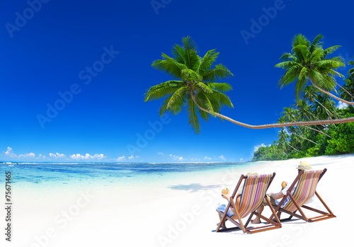Couple Relaxing on the Tropical Beach