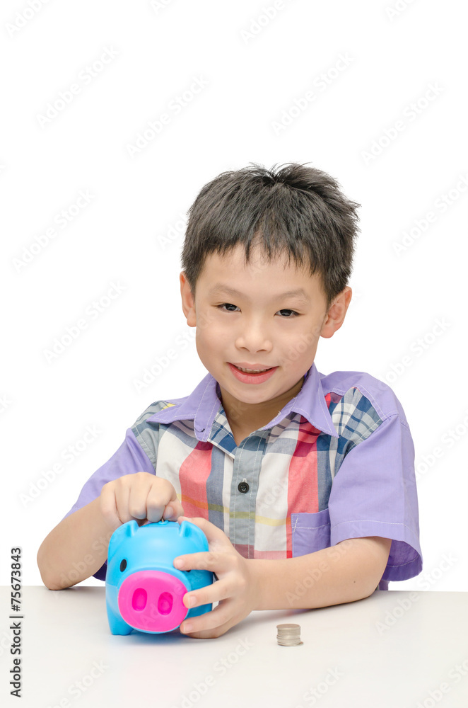 Asian smiling boy with piggy bank isolated on white Asian smiling boy with piggy bank isolated on white
