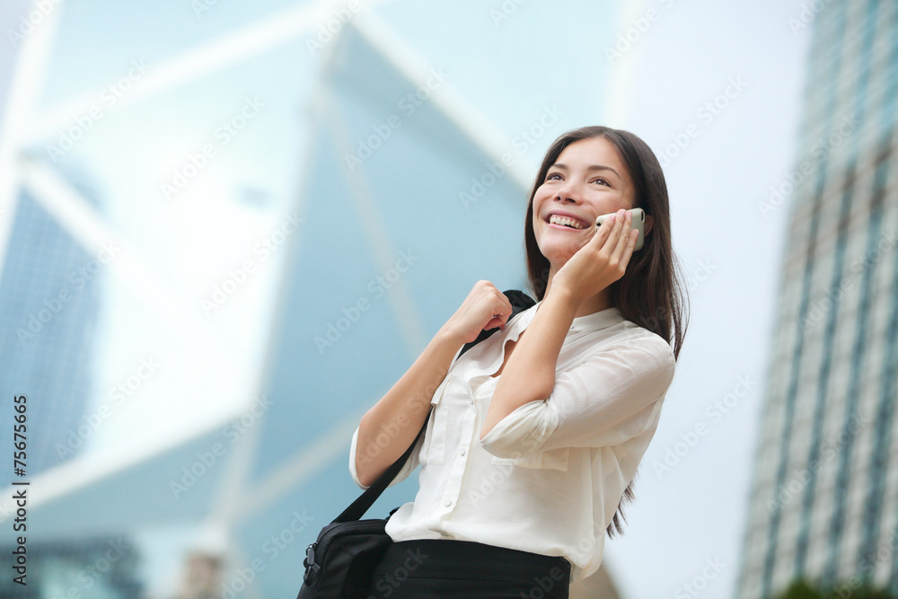 Business woman talking on smart phone in Hong Kong Business woman talking on smart phone in Hong Kong