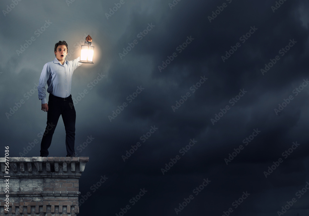 Businessman in search in darkness