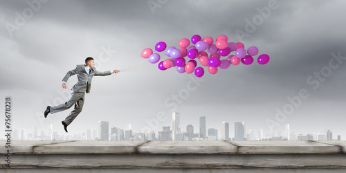 Businessman with balloons © Sergey Nivens