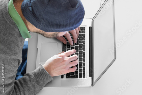 Hacker doing his job on a computer.