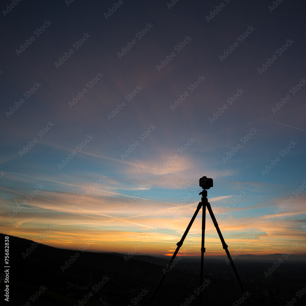 silhouette of camera on tripod