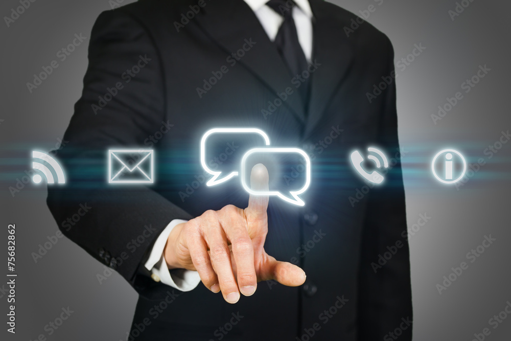 Businessman clicking on live chat icon Businessman clicking on live chat icon