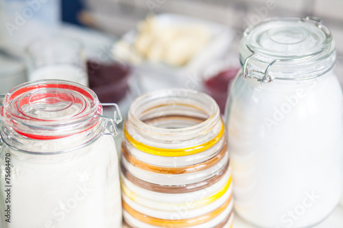 Fotografija three jars with the flour in the kitchen