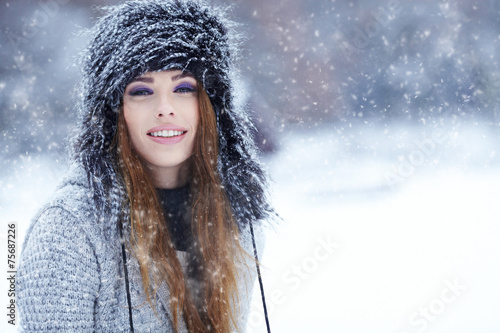 Attractive young woman in wintertime outdoor