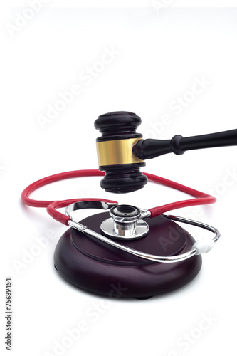 GAVEL WITH A STETHOSCOPE ON THE BASE