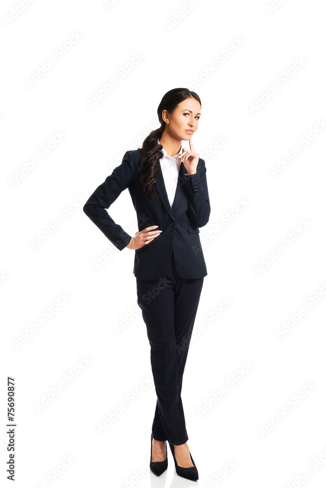 Thoughtful businesswoman with a finger under chin Thoughtful businesswoman with a finger under chin