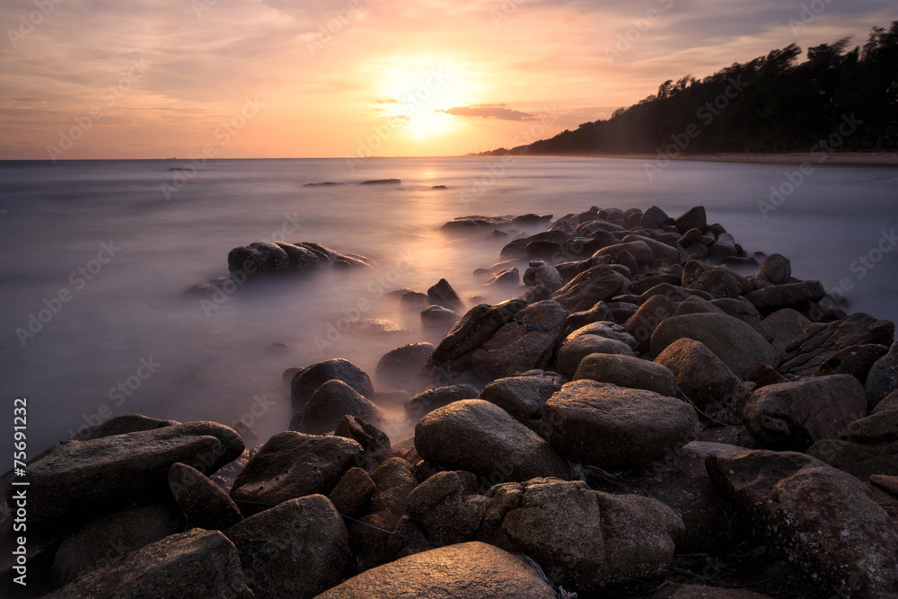 Beautiful sunset at the stone beach