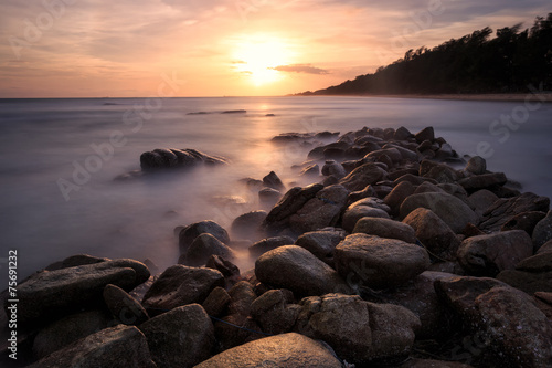 Beautiful sunset at the stone beach