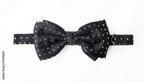 Polka dot bow tie on white background