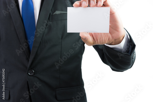 Businessman hand showing business card or note paper isolate