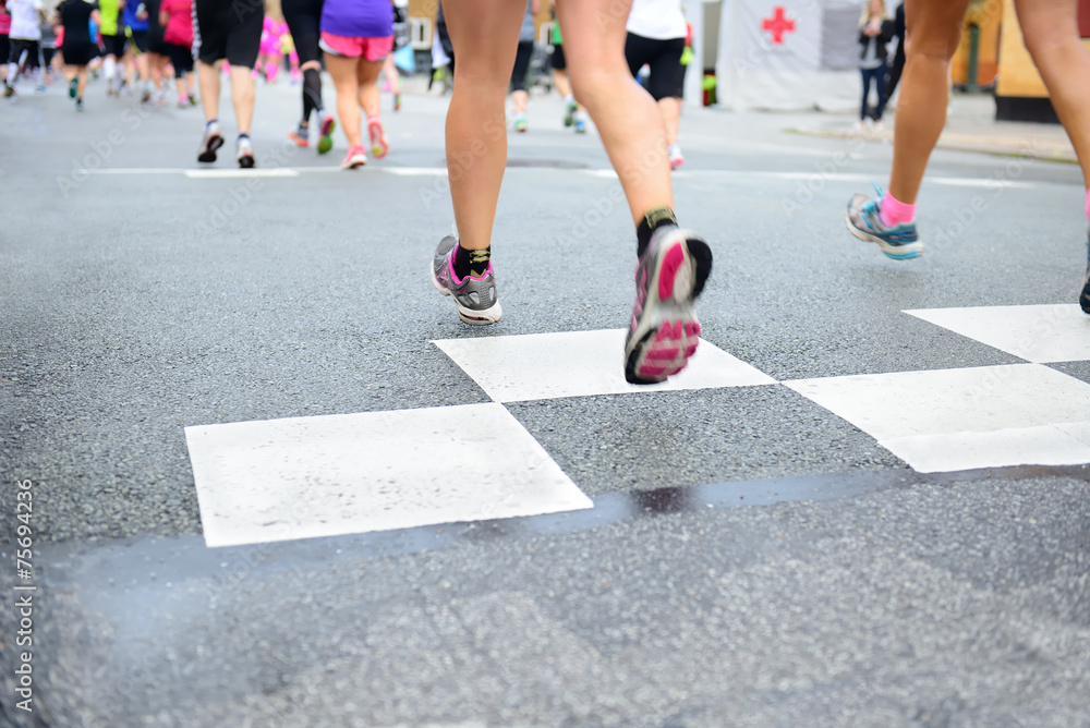 Runners crossing start or finish line Runners crossing start or finish line