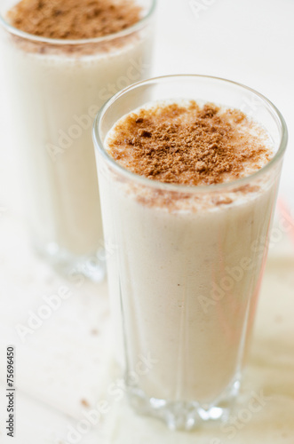 milkshake with chocolate topping in glass cup