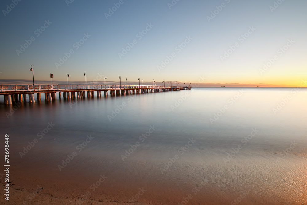 Beautiful colorful Sunrise on the pier at the seaside