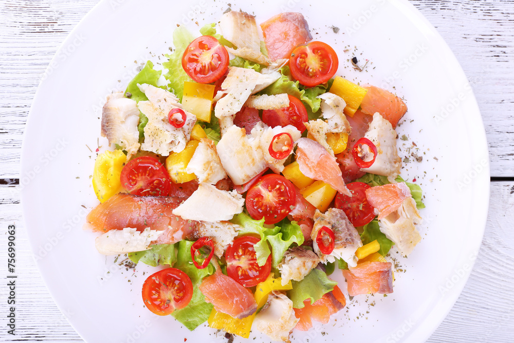 Fresh fish salad with vegetables