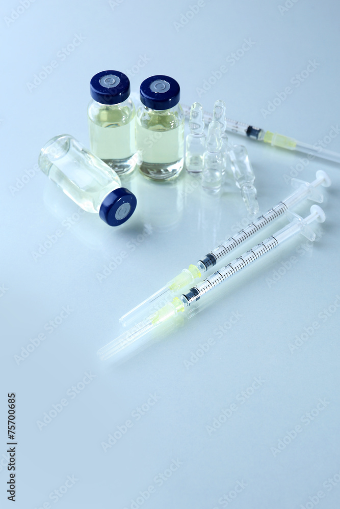 Vaccine in vial with syringe Vaccine in vial with syringe