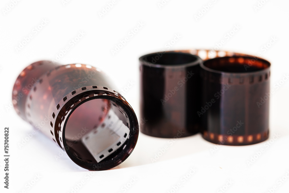 Fototapeta premium Photographic film. Film reel on white.