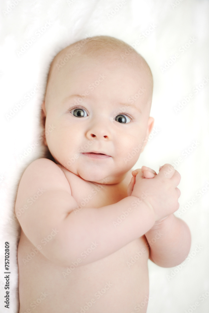 child on a white background looking at the camera child on a white background looking at the camera
