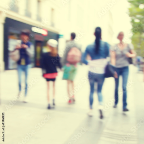 Blurred image of people in the city.