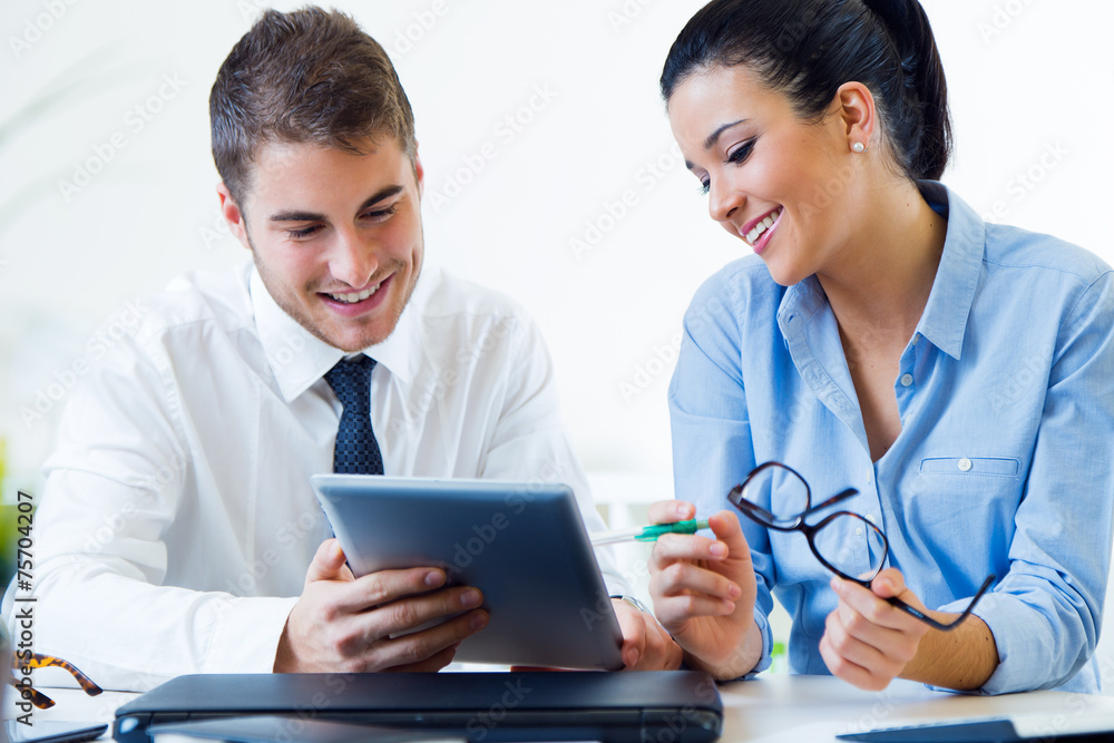 Business people working in the office with digital tablet. Business people working in the office with digital tablet.