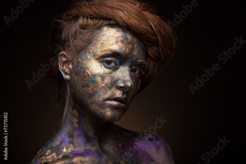 Beautyful girl with gold and grey glitter on her face. Portrait