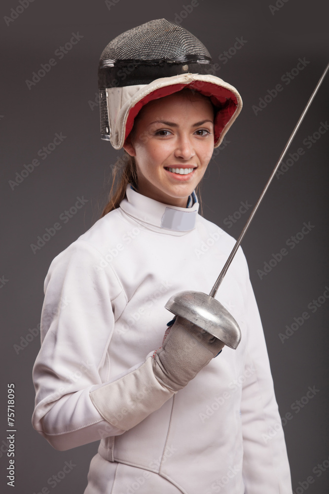 Foto Stock girl in white fencing costume. with sword and fencing mask