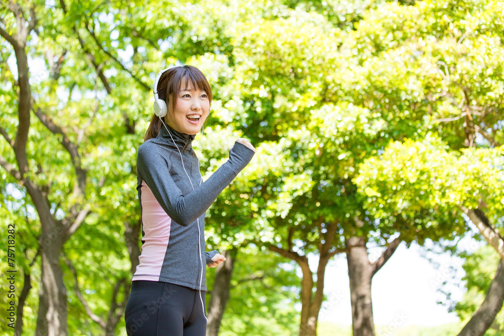 young asian woman running in the park young asian woman running in the park
