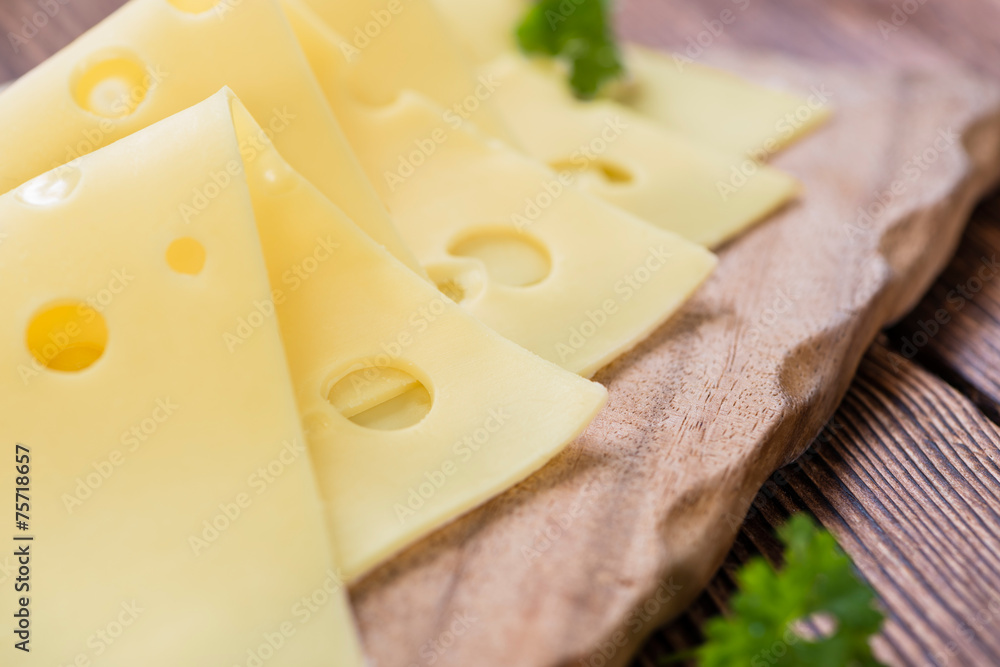 Sliced Cheese on wooden background