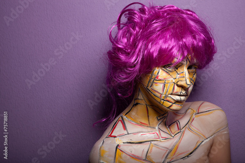 woman with violet hairstyle and wig in motion and face art