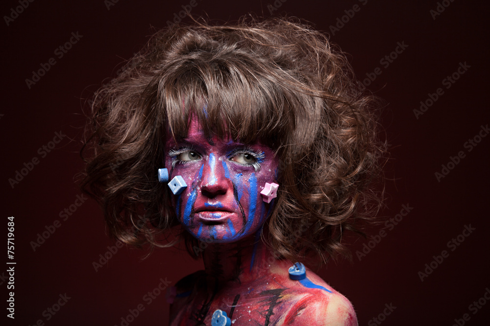 Portrait of woman covered in paint. Face art