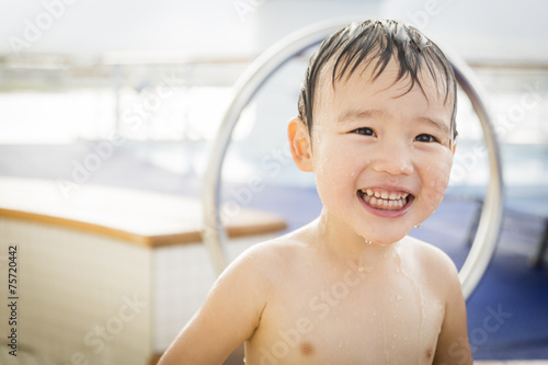 Mixed Race Boy Having Fun a...