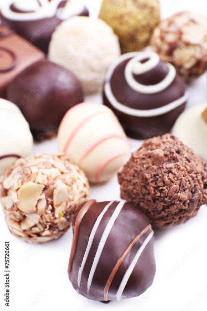 Assortment of chocolates on white background