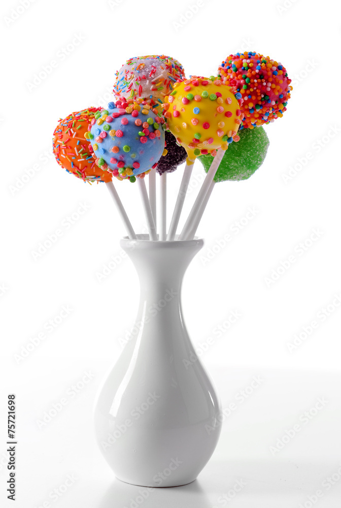 Sweet cake pops in vase isolated on white