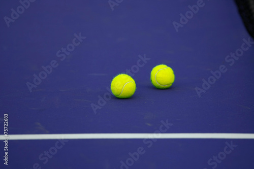tennis ball on blue court, sport background © pongmanat tasiri
