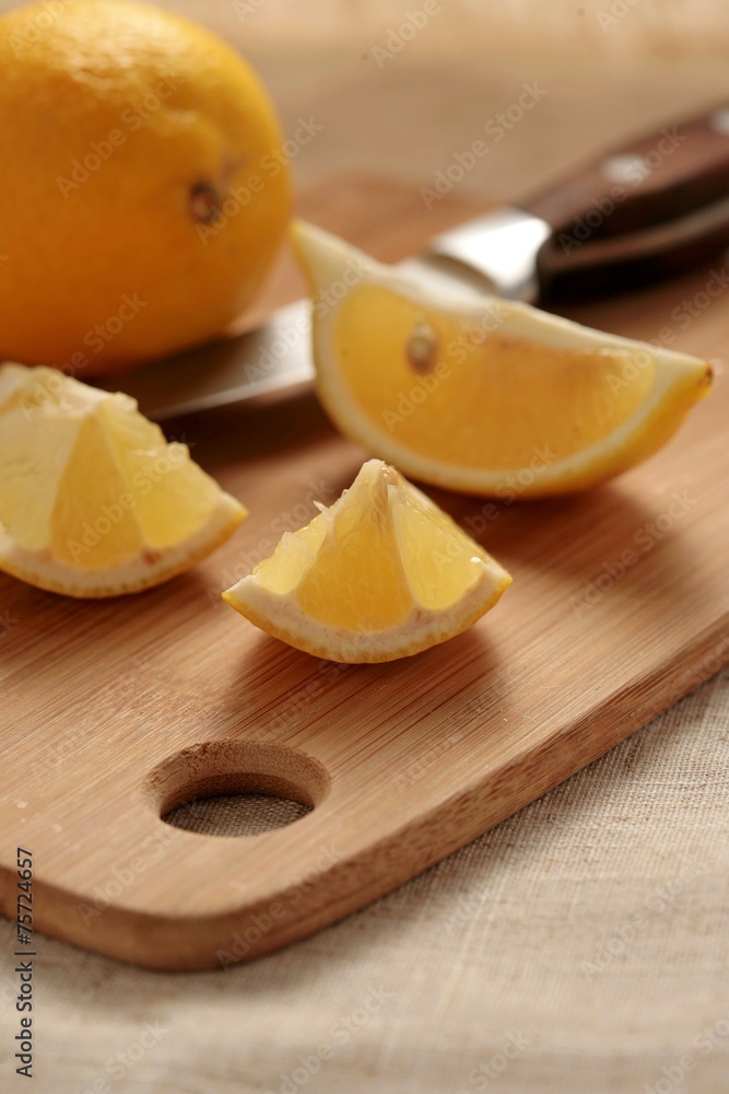 Fresh lemon on a cutting board.