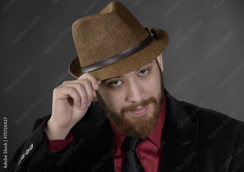 Close up Goatee Man Holding his Brown Hat Close up Goatee Man Holding his Brown Hat